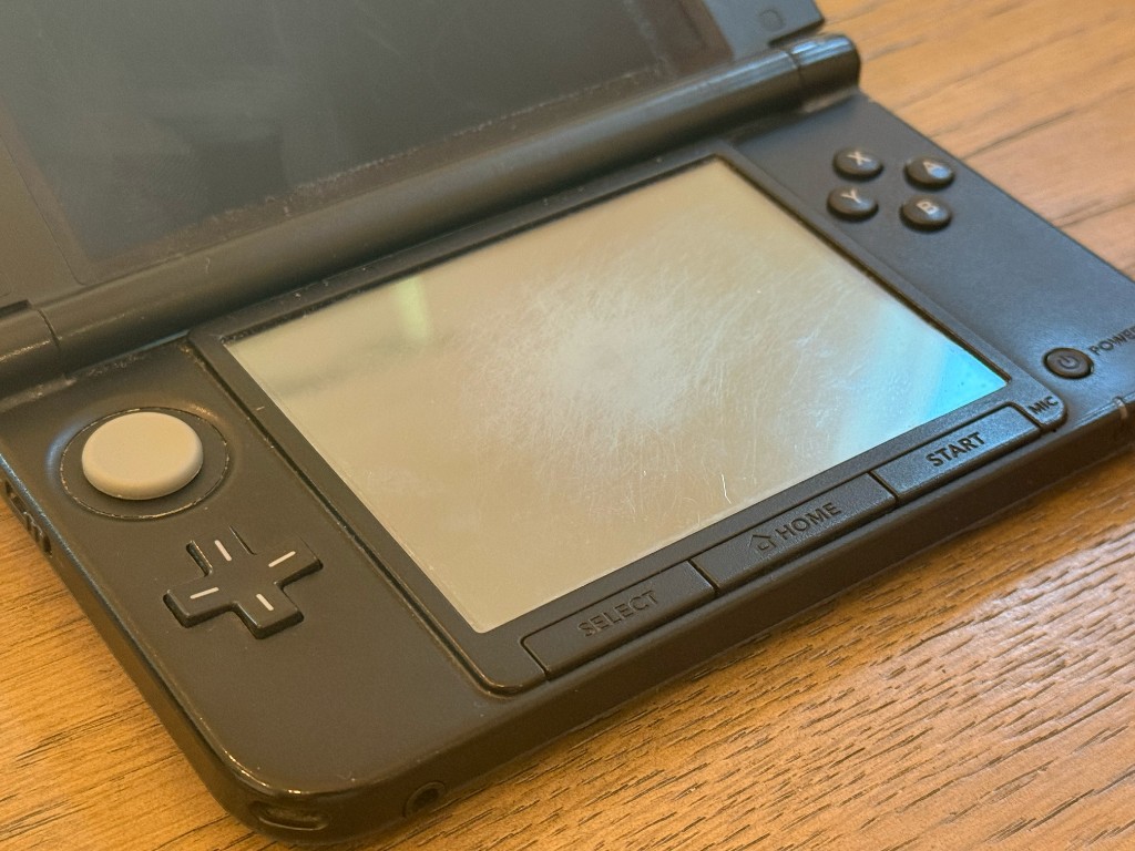 Close-up of a scratched 3DS XL touch screen before it was replaced.