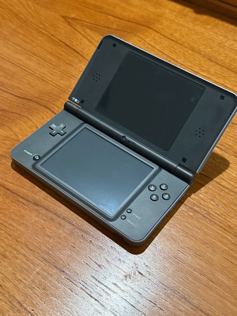 The DSi XL in a new black shell, opened, with a new digitizer and a new top lens.